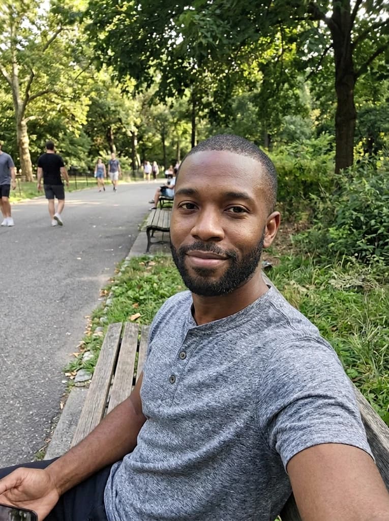 Man on a park bench, now with a neat short black beard