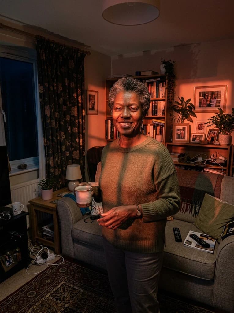 Woman in a living room, relit with directional warm side light